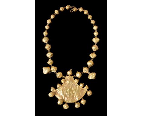 A gold coloured historismus bead necklace, in the Achaemenid style, composed of graduated fluted hollow beads to a hammered f