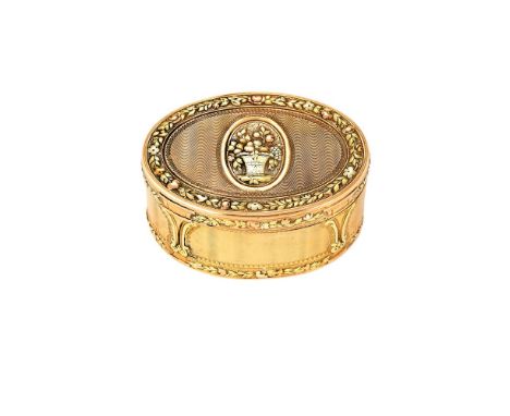 An 18th century French three-colour gold oval snuff box, very worn pre revolution marks, the cover and base with basket of fr