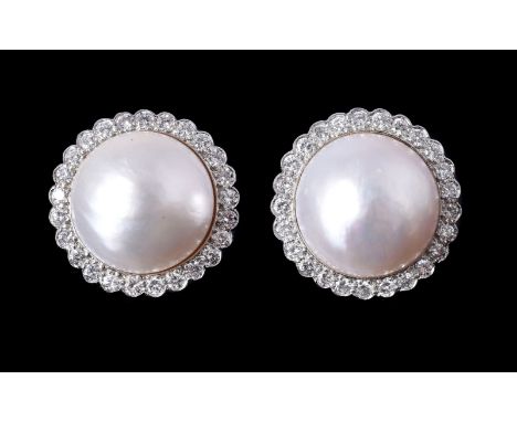 A pair of diamond and mabé pearl cluster ear clips, the circular panels each centred with a mabé pearl measuring 16mm diamete