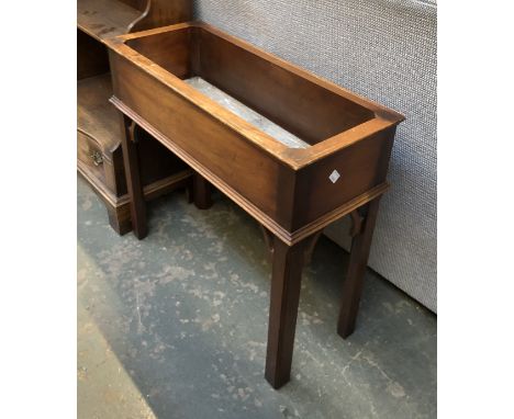 A mahogany rectangular plant stand, on George III style square chamfered legs, 63cmW 