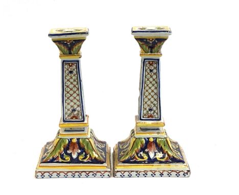A pair of Italian majolica candlestick holders (af), marked to base, 21cmH 