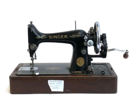 A vintage sewing machine, s/n EA122976 