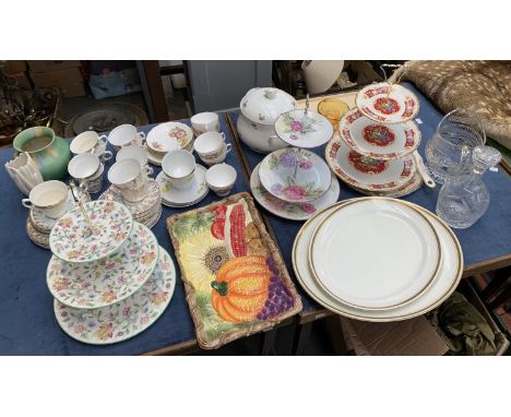 A mixed lot of ceramics to include a gold plated part tea service, Avon Ware vase; cake stands; decorative vegetable serving 