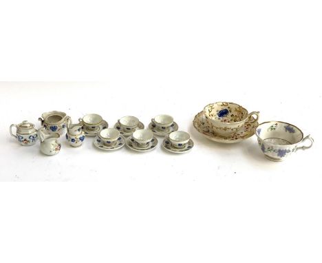 A miniature doll's tea set comprising 6 cups and saucers, jug, together with a 19th century hand painted teacup and saucer 
