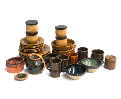 A mixed lot of studio pottery and stoneware mugs, saucers and bowls etc 