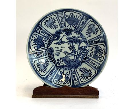 An OKA blue and white Kraak plate, 25.5cmD; on a hardwood stand 