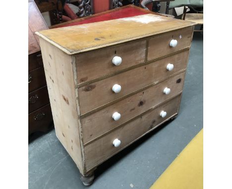 A Victorian pine chest of two short over three graduating drawers, ceramic knobs, turned legs detached, 107x48x104cmH 