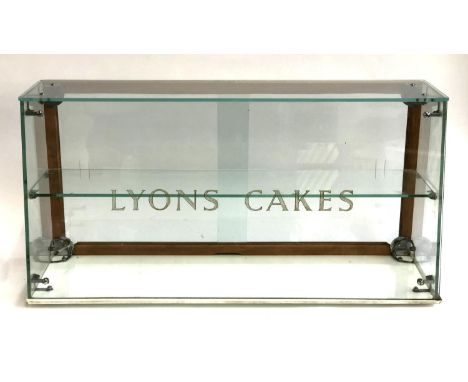 A vintage Lyons Cakes glass display cabinet with sliding doors and single shelf, ceramic base, 76cmW 