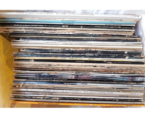 A yellow bag of vinyl LP's to include The Kinks, Elton John, Michael Jackson, Billy Joel, Genesis, Fleetwood Mac, etc 