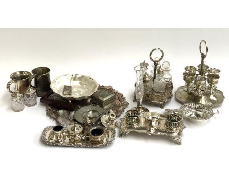 A mixed lot of plated wares to include a set of eggcups, cruet, mugs, ink stand, salts etc 