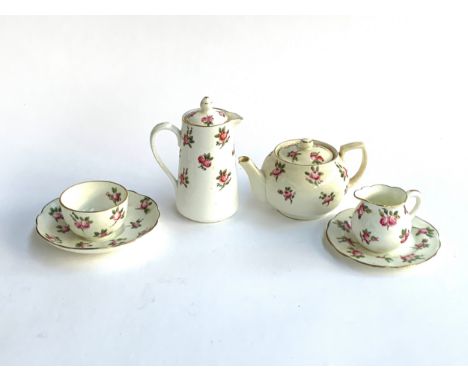 A miniature part tea service with rosebud design, comprising Hammersley and Alsagar Hayward &amp; Co. 