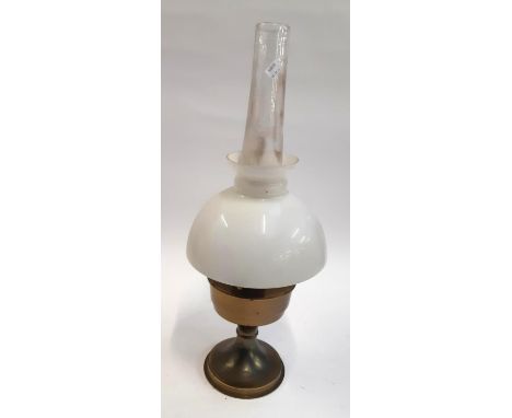 An Aladdin brass oil lamp with glass shade and chimney 
