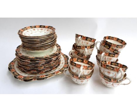 An Asbury part tea service to include teacups, saucers, cake plates, etc (approx 38 pieces) 