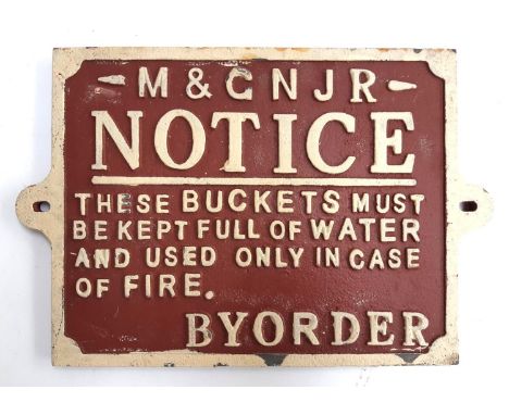 A cast iron M &amp; G N J R notice sign stating buckets must be kept full of water in case of fire, approx 33 x 22cm 