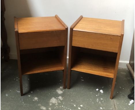 A pair of small mid century teak bedside tables, each with single drawer over shelf, 36x34x53cmH 