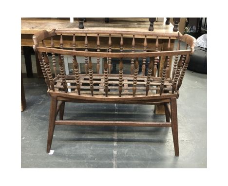 A spindle turned beechwood cradle, on stand, 107cmW