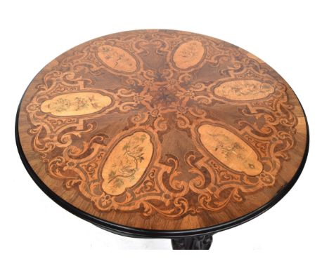 A circular marquetry table, having satinwood panels depicting songbirds, within scrolling marquetry decoration, on a base of 