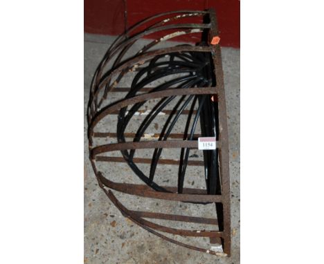 A wrought iron hayloft hopper, and one other smaller example (2)