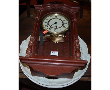 A modern stained wood droptrunk wall clock; together with a white painted circular convex wall mirror (2) 