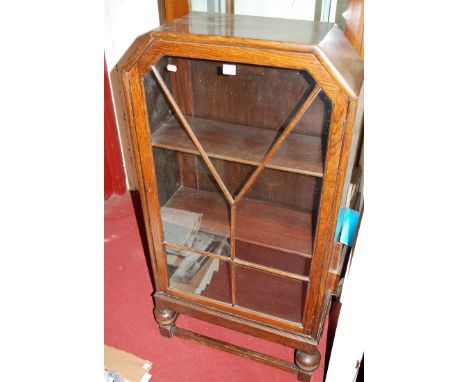 An Art Deco oak single door glazed bookcase, w.64cm