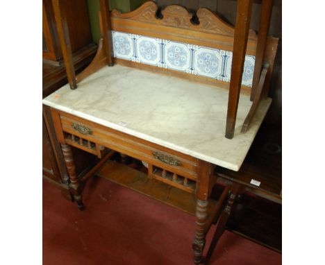 An Edwardian walnut white variegated marble topped and tile inset single drawer washstand, w.91cm 
