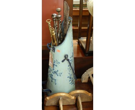 A collection of 19th century steel and brass fire tools, housed in a painted metal coal bucket; together with a pair of giltw