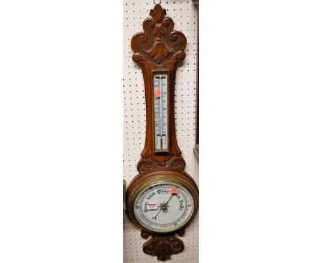 Circa 1900 carved oak aneroid wheel barometer