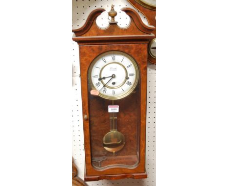 A Comitti of London reproduction walnut cased Vienna type wall clock, 60cm