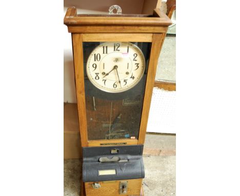 An International Time Recording Company Ltd of London oak cased clocking-in clock