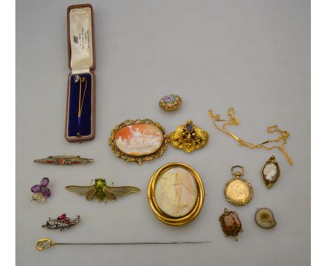 A mixed lot containing various vintage and antique items, two cameo brooches in gilt metal frames, Victorian gilt metal garne