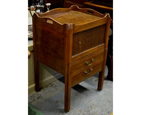 A 19th century mahogany tray-top commode with tambour door over a step drawer faced as two drawers