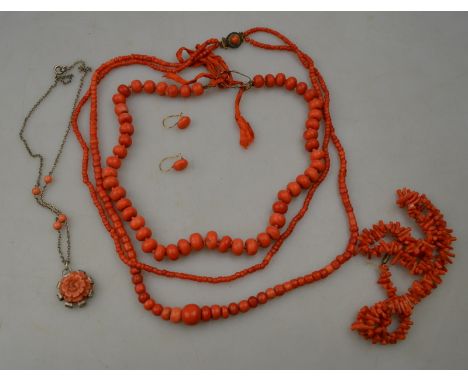 A row of graduated coral beads to/w double row coral beads, row of stick coral, carved coral flower pendant, pair of coral ea