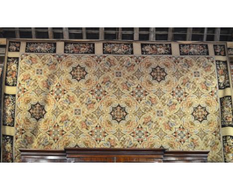 A large Aubusson carpet, wool, the overall soft multi-coloured floral design on dark ground, 530 x 340 cm