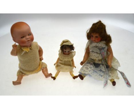An Armand Marseille 341/2.k. bisque-headed baby doll with closing blue eyes, on five-piece composition body, 26 cm, to/w a sm