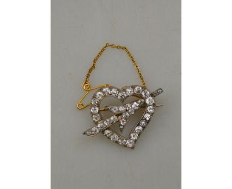 An open style diamond set heart and arrow brooch, yellow gold and silver setting, 25 x 30mm overall Condition Report Possibly