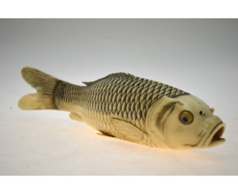 AMENDED CONDITION REPORT A Japanese Meiji period carved ivory carp with gaping mouth, tortoiseshell eyes and finely-detailed 