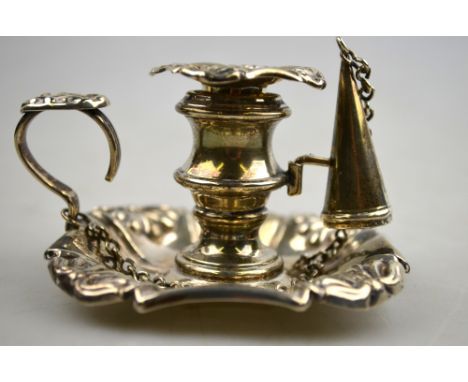 A George IV silver chamber taper-stick with honeysuckle decoration, scroll handle and conical snuffer, John Settle & Henry Wi