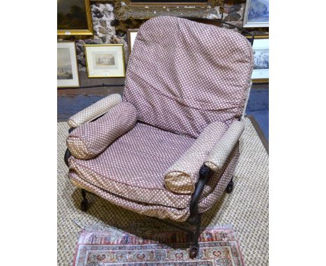 A 19th century metamorphic folding campaign chair/bed with sprung steel slats raised on ceramic castors, complete with mattre