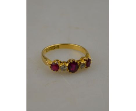 A Victorian ruby and diamond five stone claw set ring, Chester, 1899 Condition Report Rubies having rubbed facet edges and si