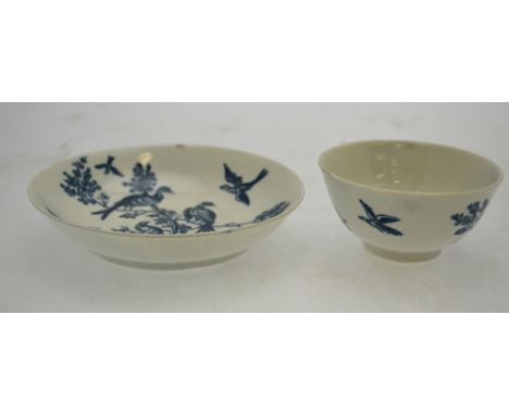 A First Period Worcester  blue and white porcelain tea bowl and saucer decorated with birds in a tree in a hilly landscape, u