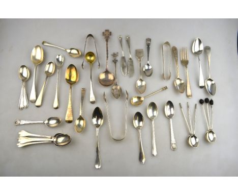A mixed selection of Georgian and later silver teaspoons and other flatware, 16.6 oz