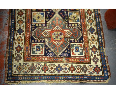 An antique Caucasian/Kurd runner, the geometric pole design on blue ground, 410 x 117 cm Condition Report Even wear, low pile