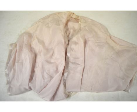 A collection of 1920's ladies' clothing comprising; a peach silk chiffon blouse with lace edged bow detail, a peach chiffon n