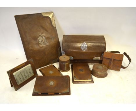 An Asprey of London silver-mounted leather desk set, comprising stationery box, A3-size blotter pad in folder, cylindrical tr