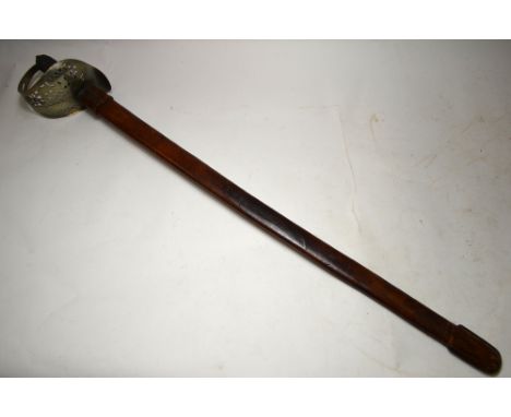 A George V military sword with 82 cm slightly curved fullered blade, pierced basket hilt and wired fishskin grip, in leather 