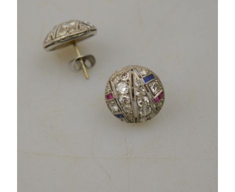 A pair of Art Deco diamond ruby and sapphire set dome style stud earrings set with old and eight-cut diamonds and baguette cu