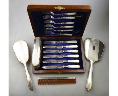 An Art Deco style engine-turned four-piece brush set including hand-mirror and comb, Mappin & Webb, Birmingham 1962, to/w an 