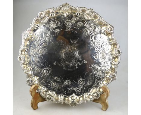 A George II silver salver with shell and gadroon-cast scrolling rim, floral and scroll-engraved border and later-inset centra