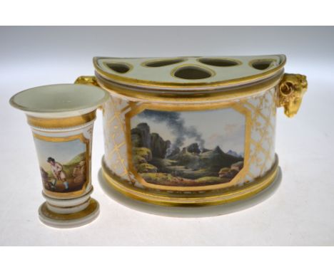 A late 18th century/early 19th century Derby porcelain bough pot and cover having two ram's head handles, decorated with a re