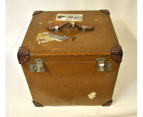 A vintage leather large 'cube-shaped' cabin trunk with labels for Cunard White Star Line, with moire fabric lining and lift-o